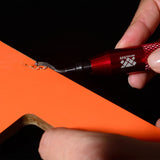 Deburring tool in use on wood surface