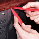 red radio removal tools in use by mechanic