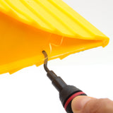 Deburring tool in use on yellow plastic piece